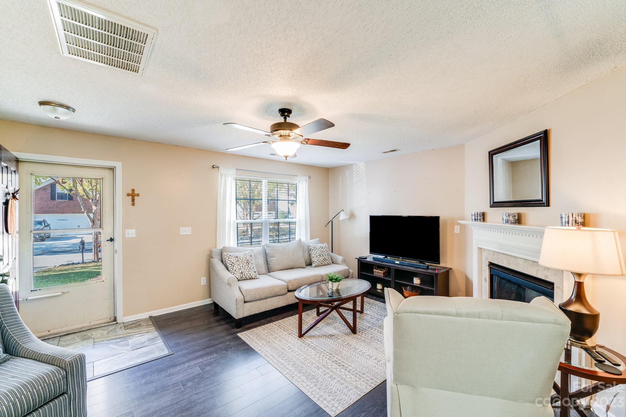 513 Red Oak Court Tega Cay, SC 29708 - Photo 3 of 21 a living room with furniture and a flat screen tv