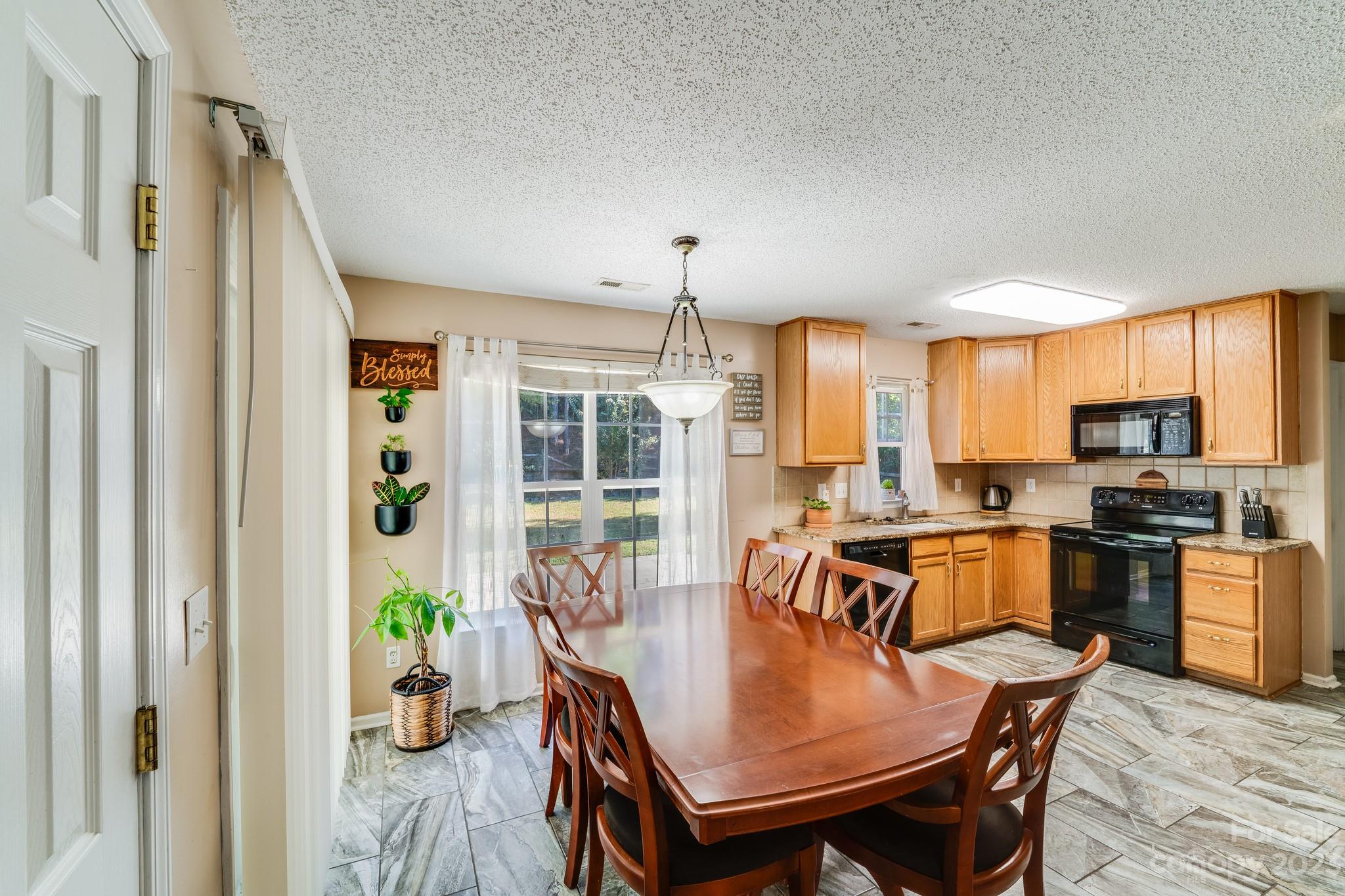 513 Red Oak Court Tega Cay, SC 29708 - Photo 5 of 21 a view of a dining room with furniture window and wooden floor