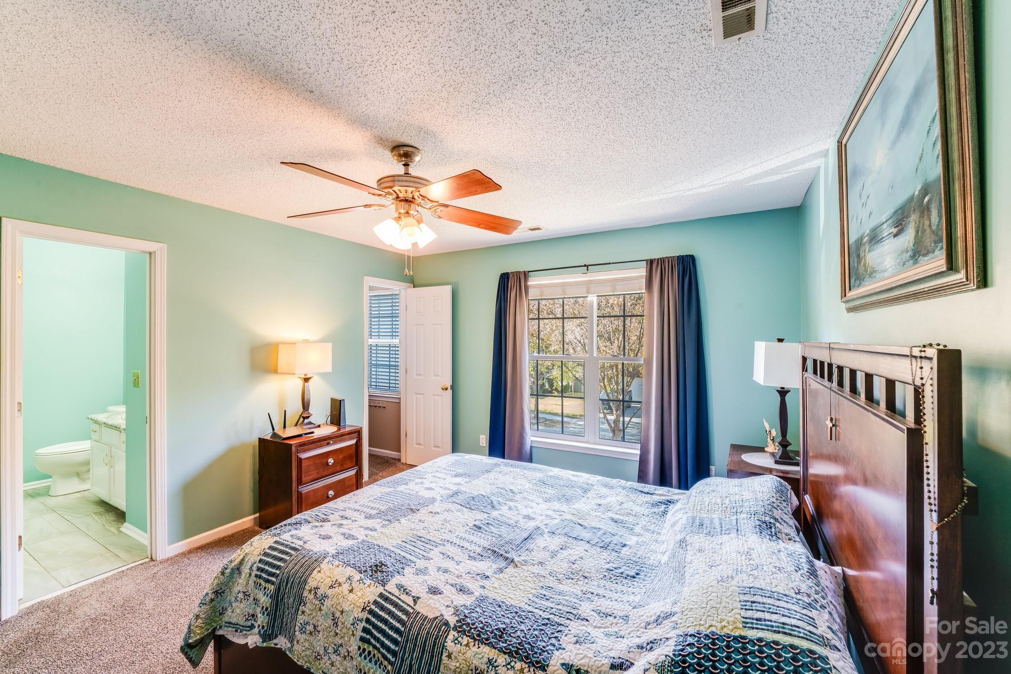 513 Red Oak Court Tega Cay, SC 29708 - Photo 10 of 21 a bedroom with a bed dresser and a window