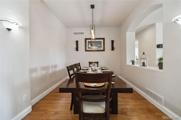 a dining room with furniture and window