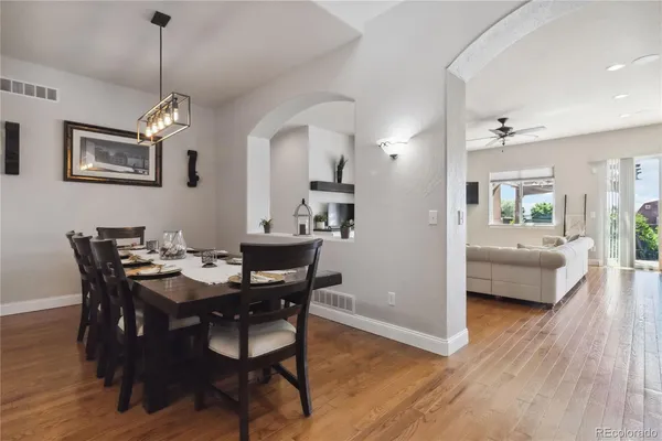 a view of a dining room with furniture and wooden floor