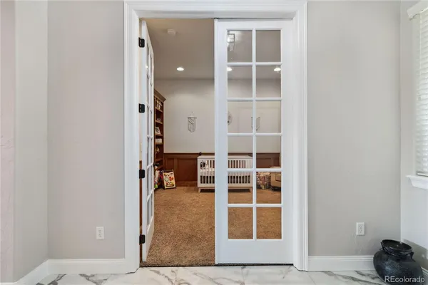 hallway with wooden floor and windows