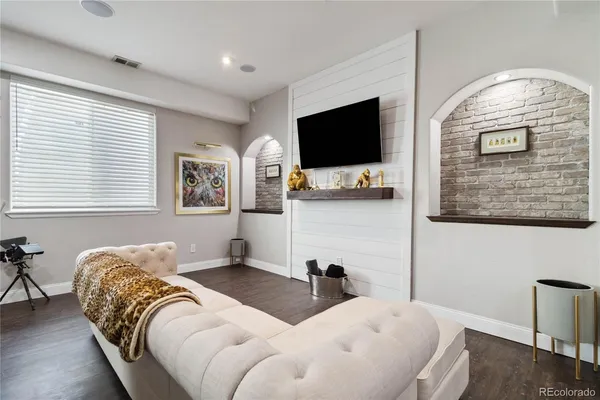 a bedroom with two beds and a flat screen tv
