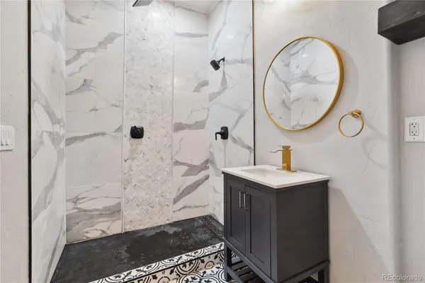 a bathroom with a sink and a mirror