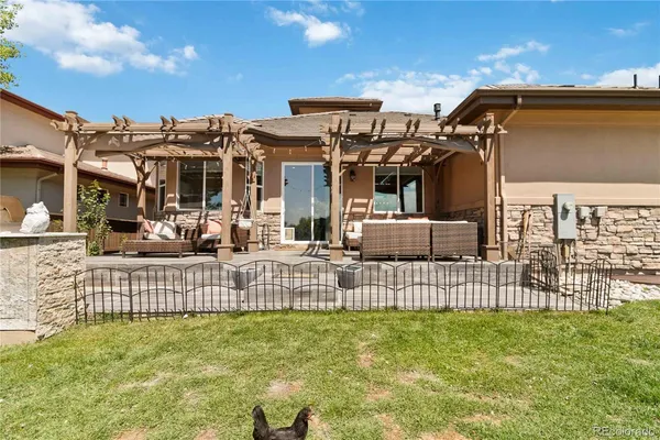 a view of a house with wooden fence