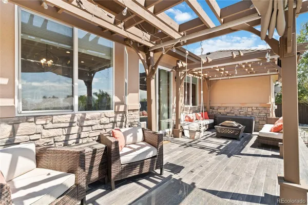 a outdoor space with patio lots of furniture and glass door