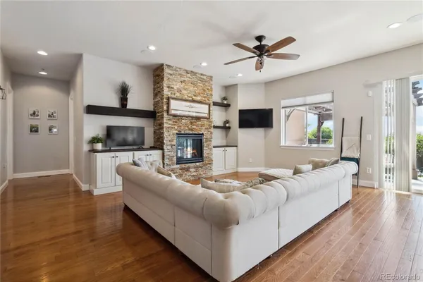 a living room with furniture fireplace and a flat screen tv