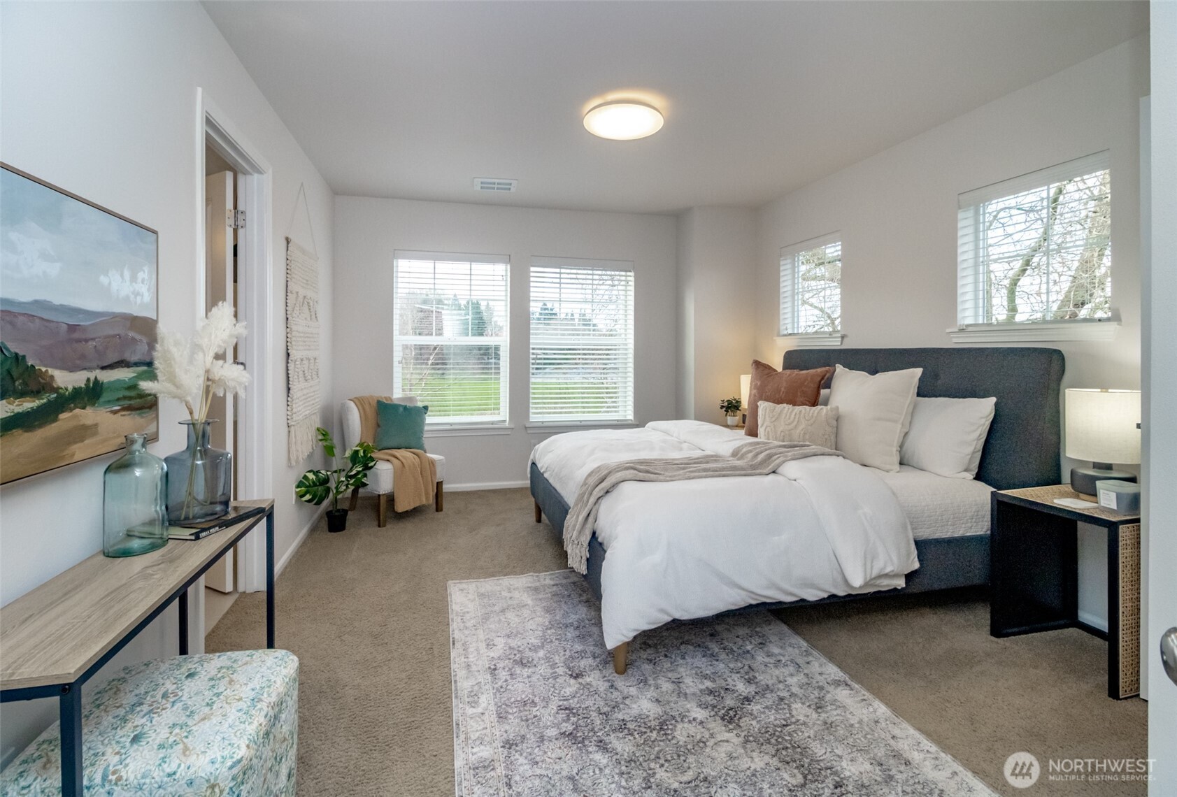 6830 31st Avenue Southwest Seattle, WA 98126 - Photo 15 of 28 a bedroom with a bed couch and a large window