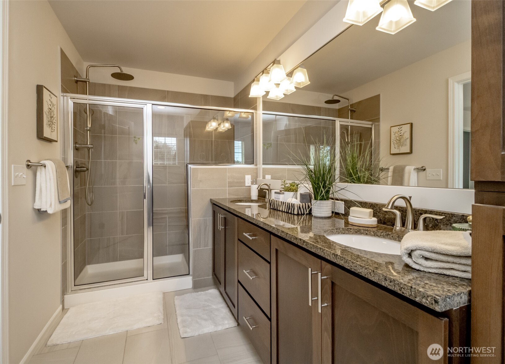 6830 31st Avenue Southwest Seattle, WA 98126 - Photo 19 of 28 a bathroom with a granite countertop sink mirror and double