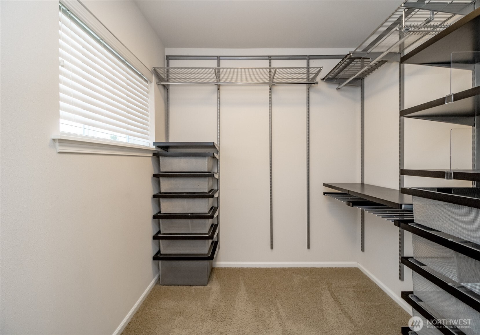 6830 31st Avenue Southwest Seattle, WA 98126 - Photo 20 of 28 a view of a room with racks on the wall