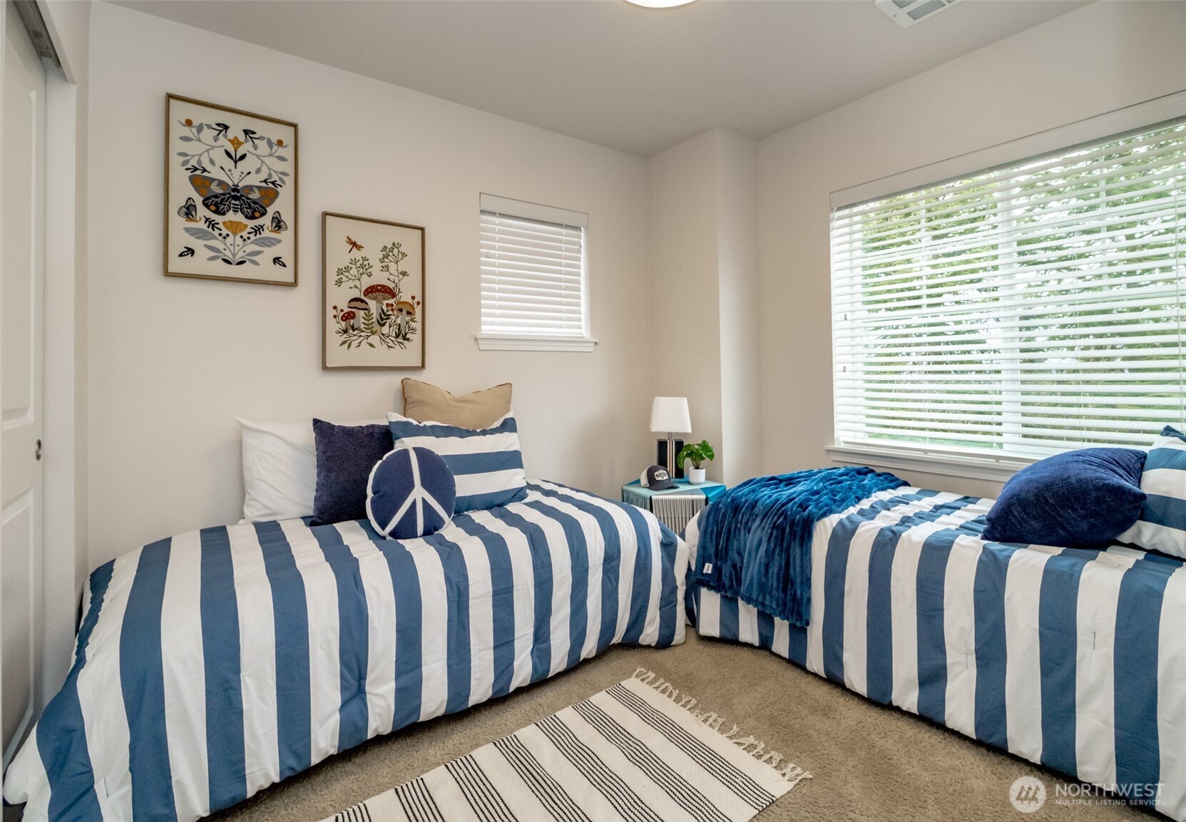 6830 31st Avenue Southwest Seattle, WA 98126 - Photo 23 of 28 a bedroom with two beds next to a window