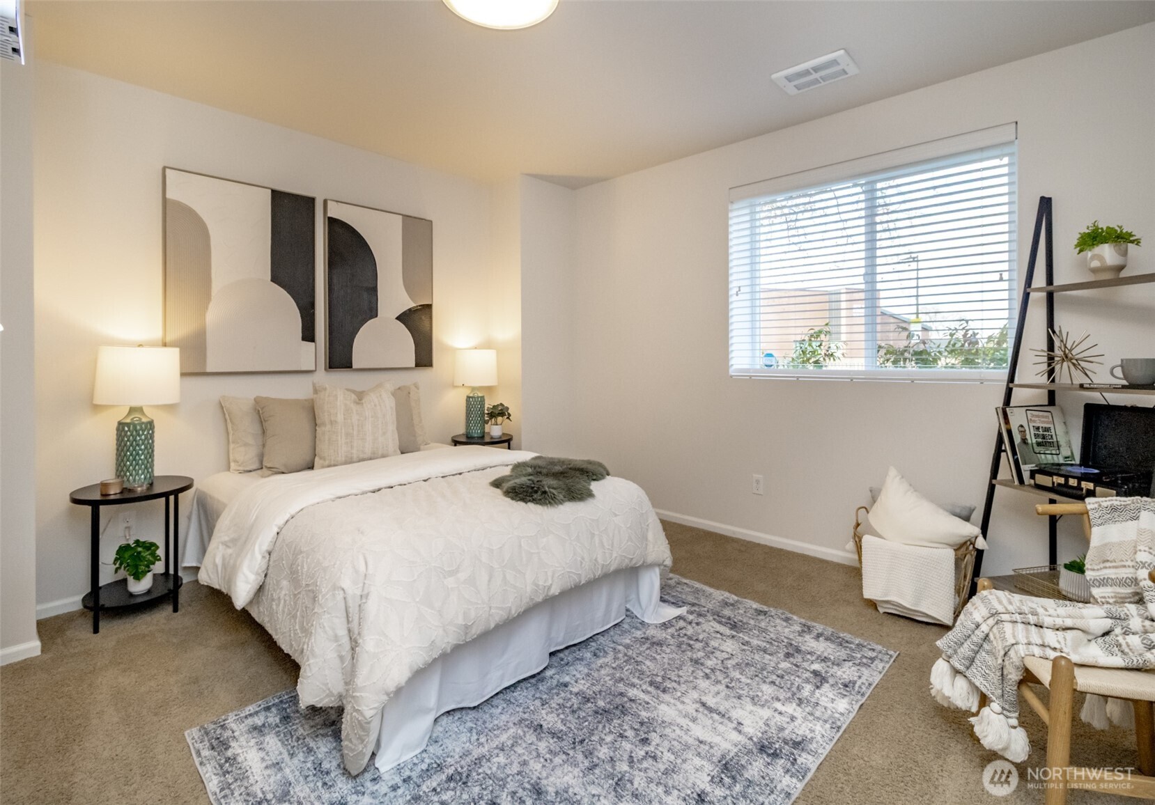 6830 31st Avenue Southwest Seattle, WA 98126 - Photo 24 of 28 a bedroom with a bed a mirror and desk