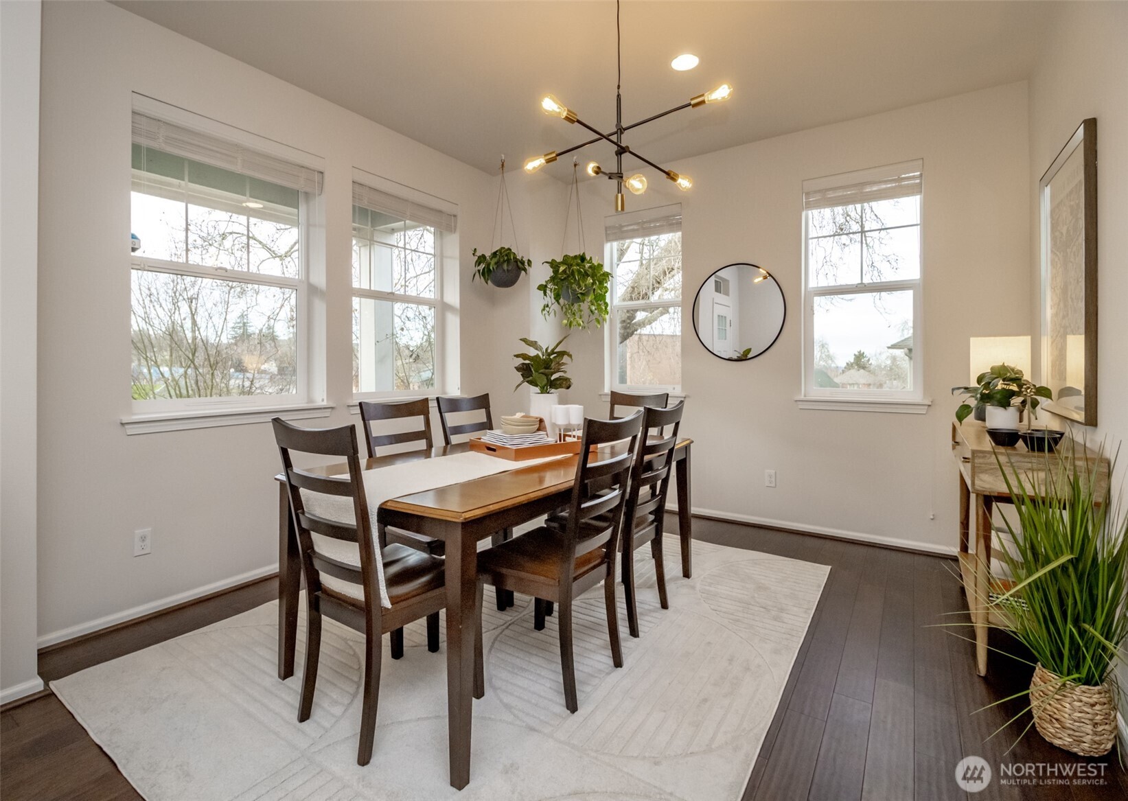 6830 31st Avenue Southwest Seattle, WA 98126 - Photo 6 of 28 a view of a dining room with furniture window and wooden floor