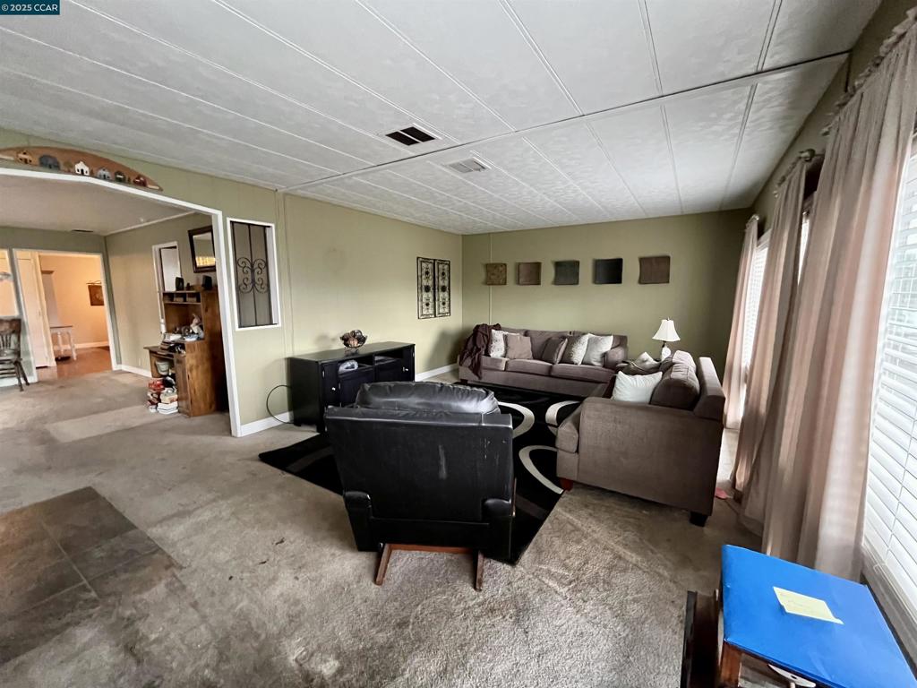 189 Cairo Drive Pacheco, CA 94553 - Photo 6 of 15 a living room with furniture and a flat screen tv