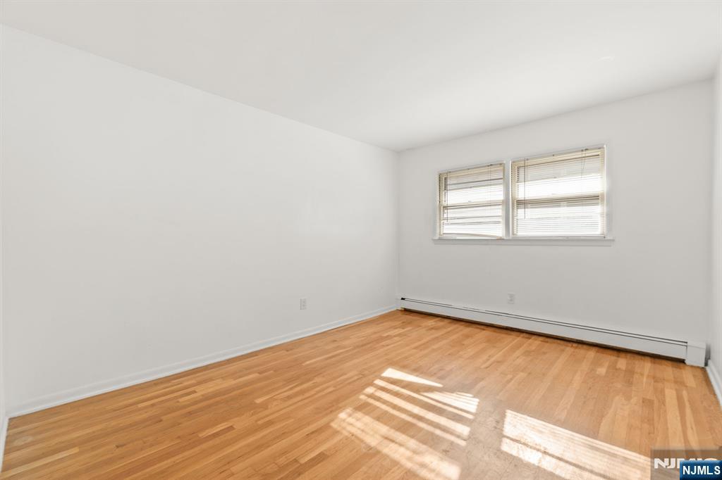 24 East Ruby Avenue, Unit 2 Palisades Park, NJ 07650 - Photo 12 of 19 an empty room with a window