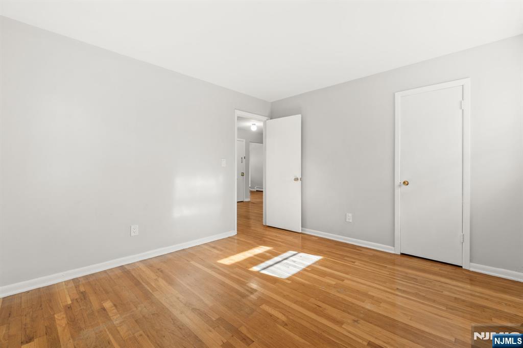 24 East Ruby Avenue, Unit 2 Palisades Park, NJ 07650 - Photo 15 of 19 a view of empty room with wooden floor