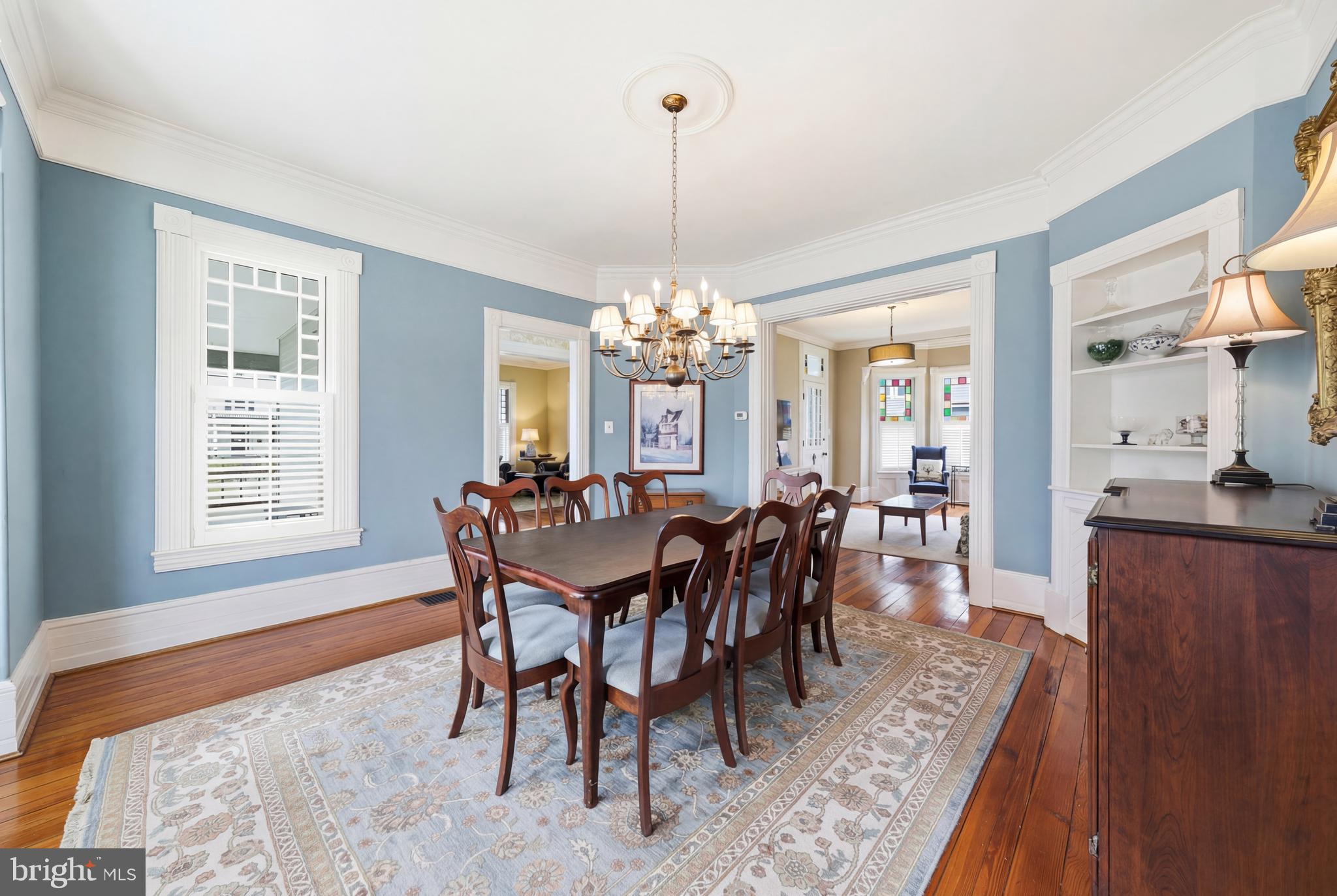 323 Washington Avenue Haddonfield, NJ 08033 - Photo 22 of 57 a dining room with furniture a chandelier and wooden floor