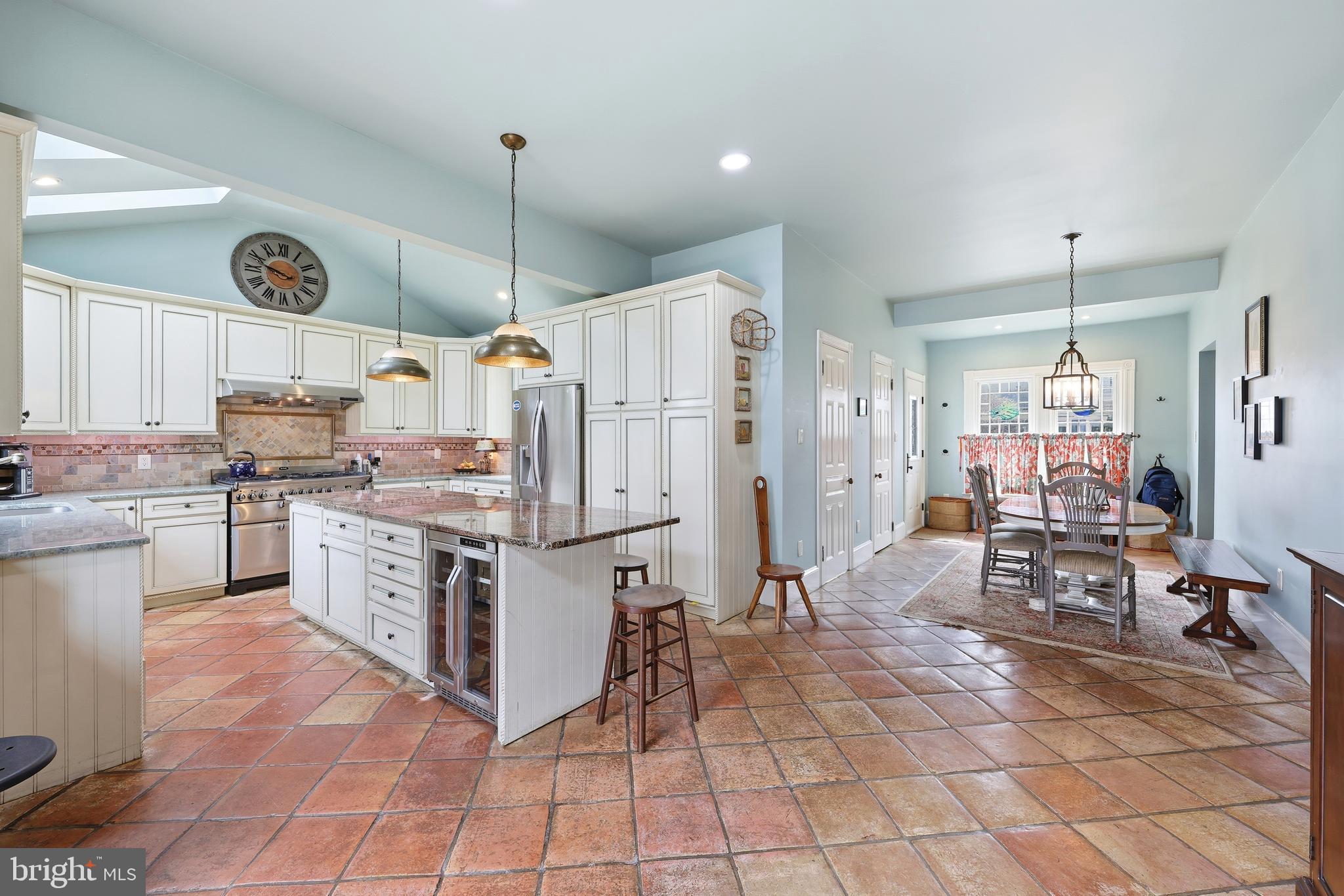 323 Washington Avenue Haddonfield, NJ 08033 - Photo 30 of 57 a kitchen with granite countertop a stove a sink and a refrigerator