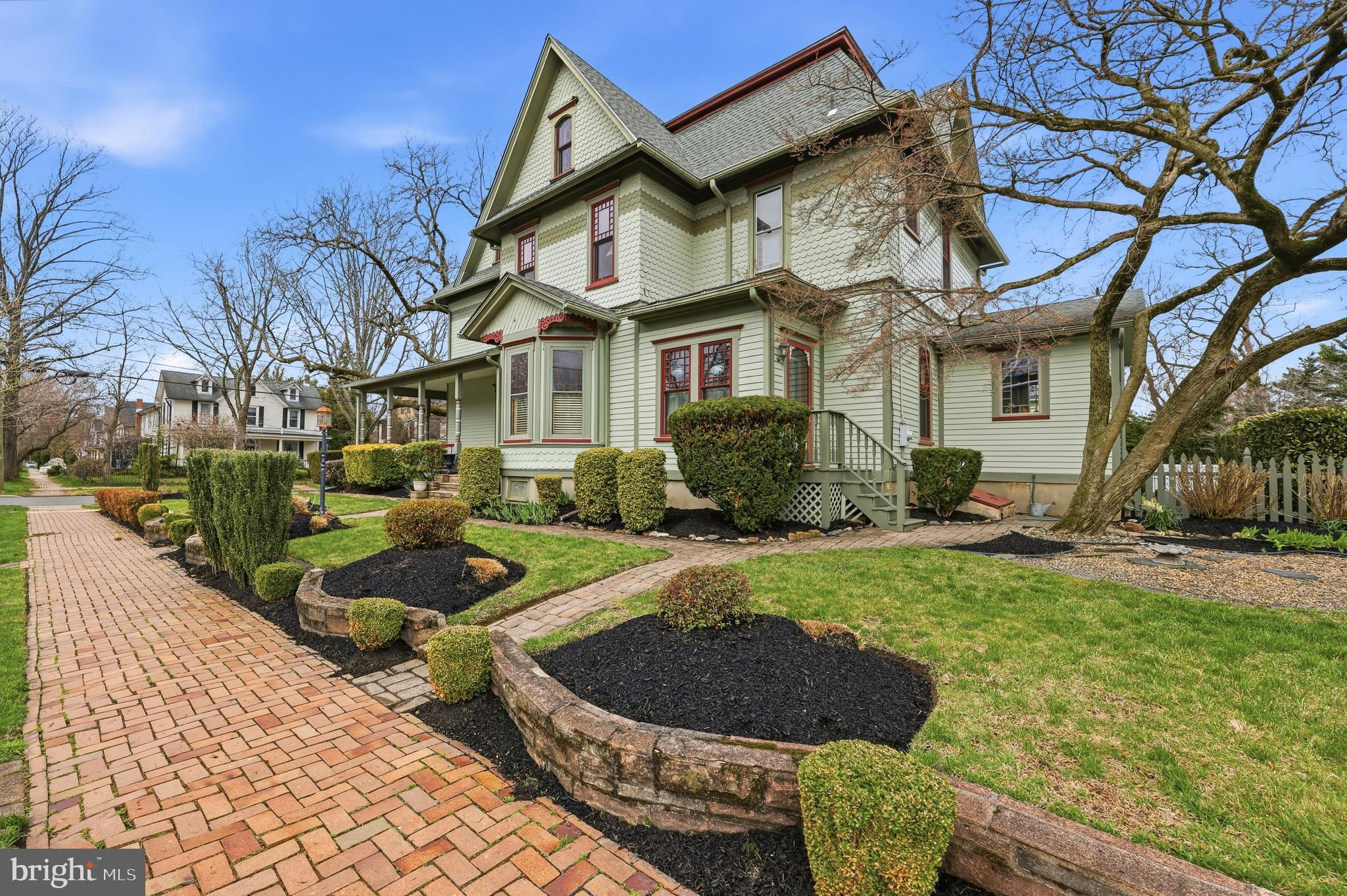 323 Washington Avenue Haddonfield, NJ 08033 - Photo 3 of 57 a view of a white house with a chairs in a patio