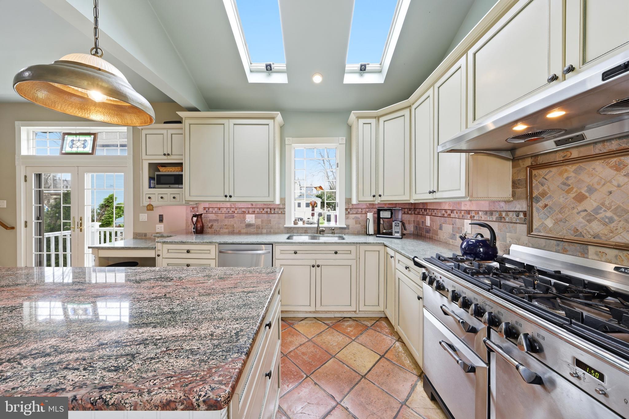 323 Washington Avenue Haddonfield, NJ 08033 - Photo 34 of 57 a kitchen with stainless steel appliances granite countertop a sink stove and cabinets