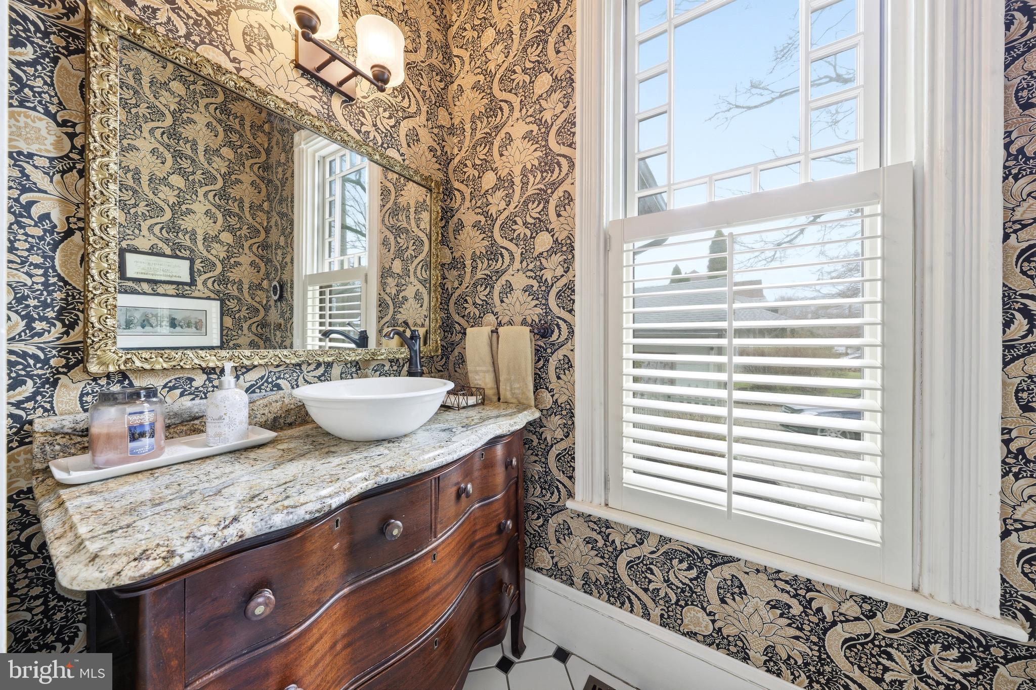 323 Washington Avenue Haddonfield, NJ 08033 - Photo 37 of 57 a bathroom with a granite countertop sink and a window