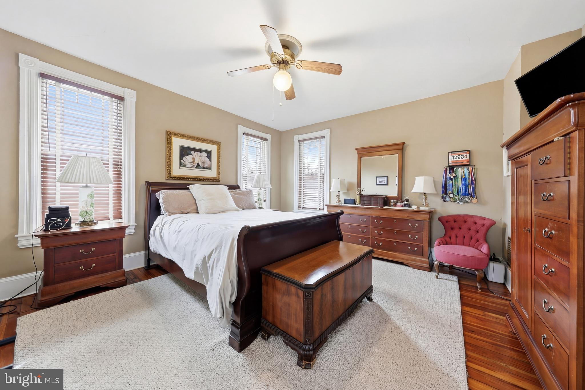 323 Washington Avenue Haddonfield, NJ 08033 - Photo 39 of 57 a spacious bedroom with a bed couch and window