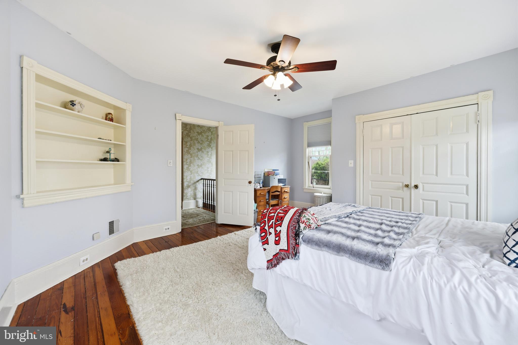 323 Washington Avenue Haddonfield, NJ 08033 - Photo 44 of 57 a bedroom with a bed and a chandelier