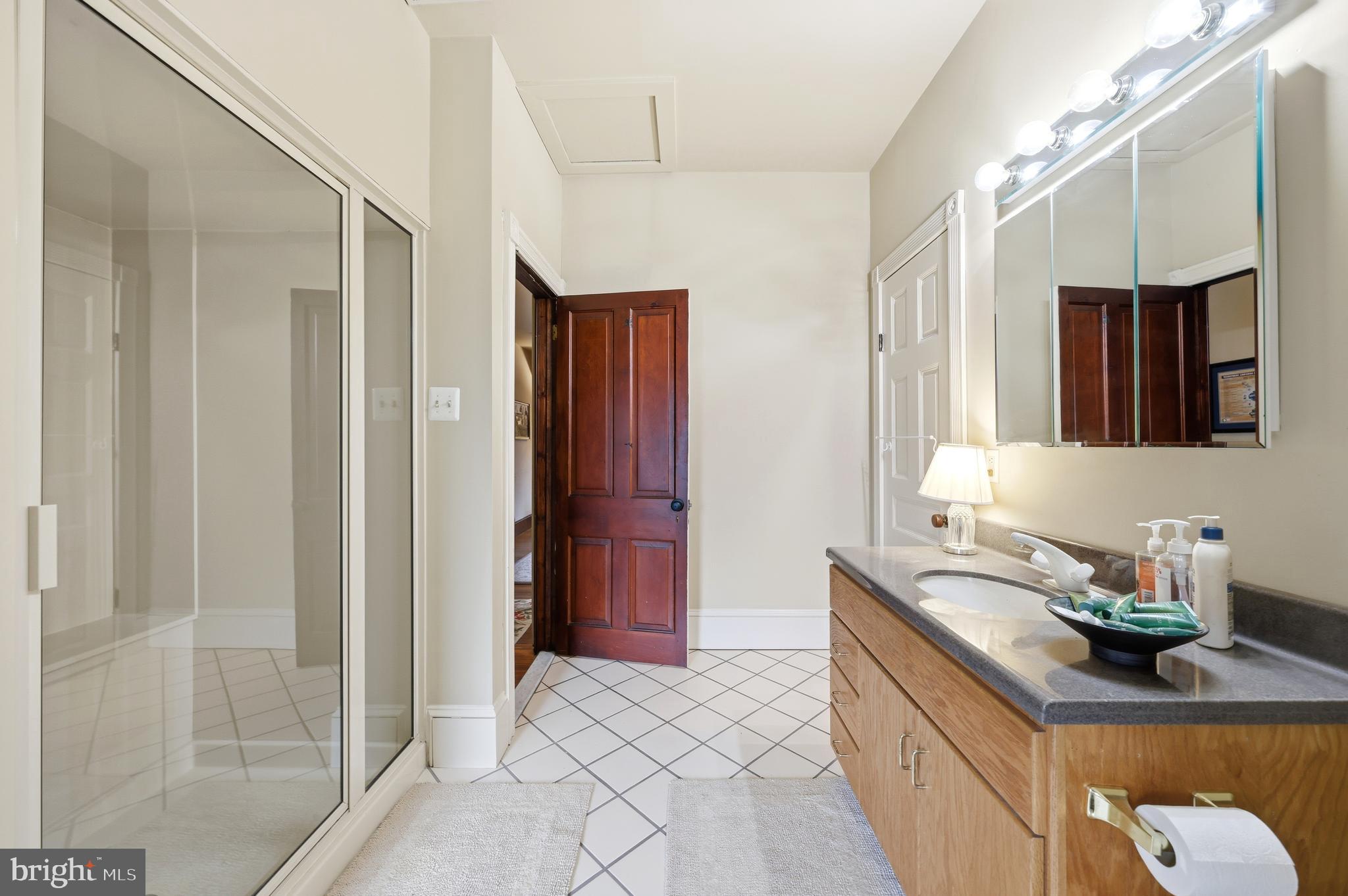 323 Washington Avenue Haddonfield, NJ 08033 - Photo 54 of 57 a bathroom with a sink a mirror and a shower