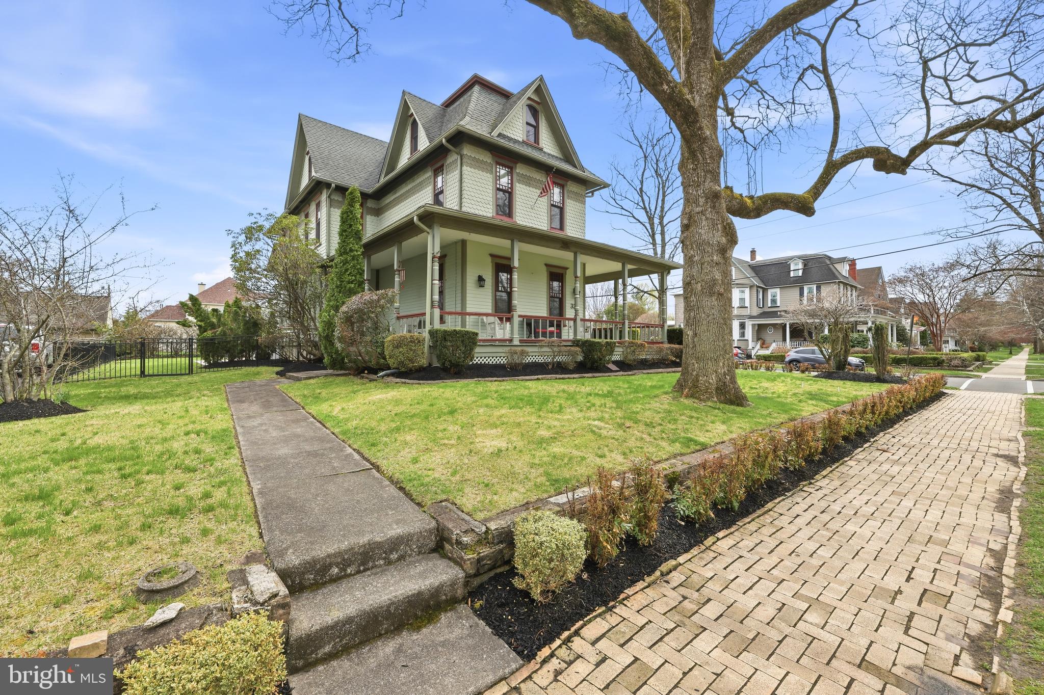 323 Washington Avenue Haddonfield, NJ 08033 - Photo 6 of 57 a view of a big building with big yard and large trees