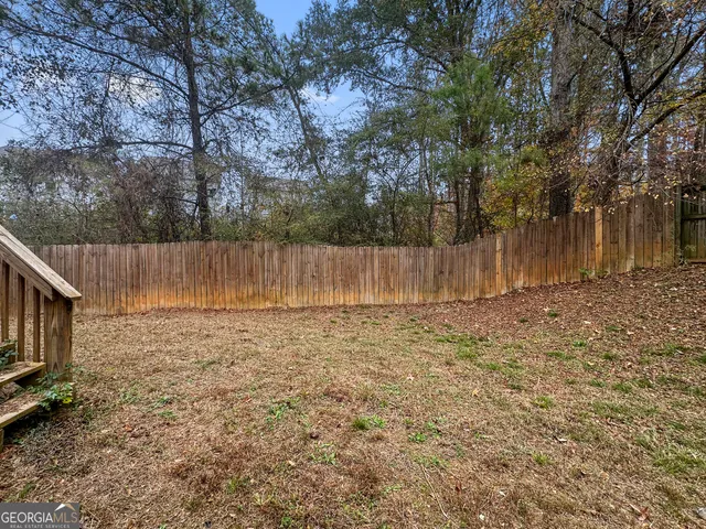a backyard of a house with lots of green space