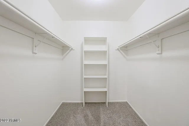 a view of an empty walk in closet