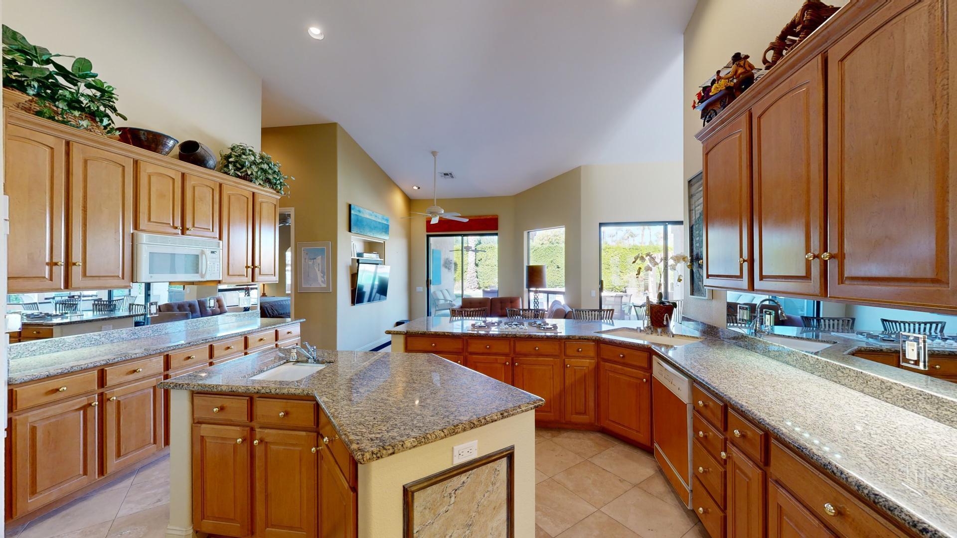 70410 Cobb Road Rancho Mirage, CA 92270 - Photo 33 of 75 a kitchen with lots of counter top space and a sink