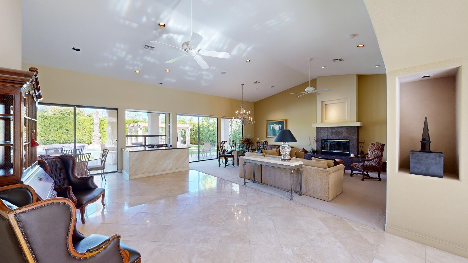 70410 Cobb Road Rancho Mirage, CA 92270 - Photo 4 of 75 a living room with fireplace furniture and a large window