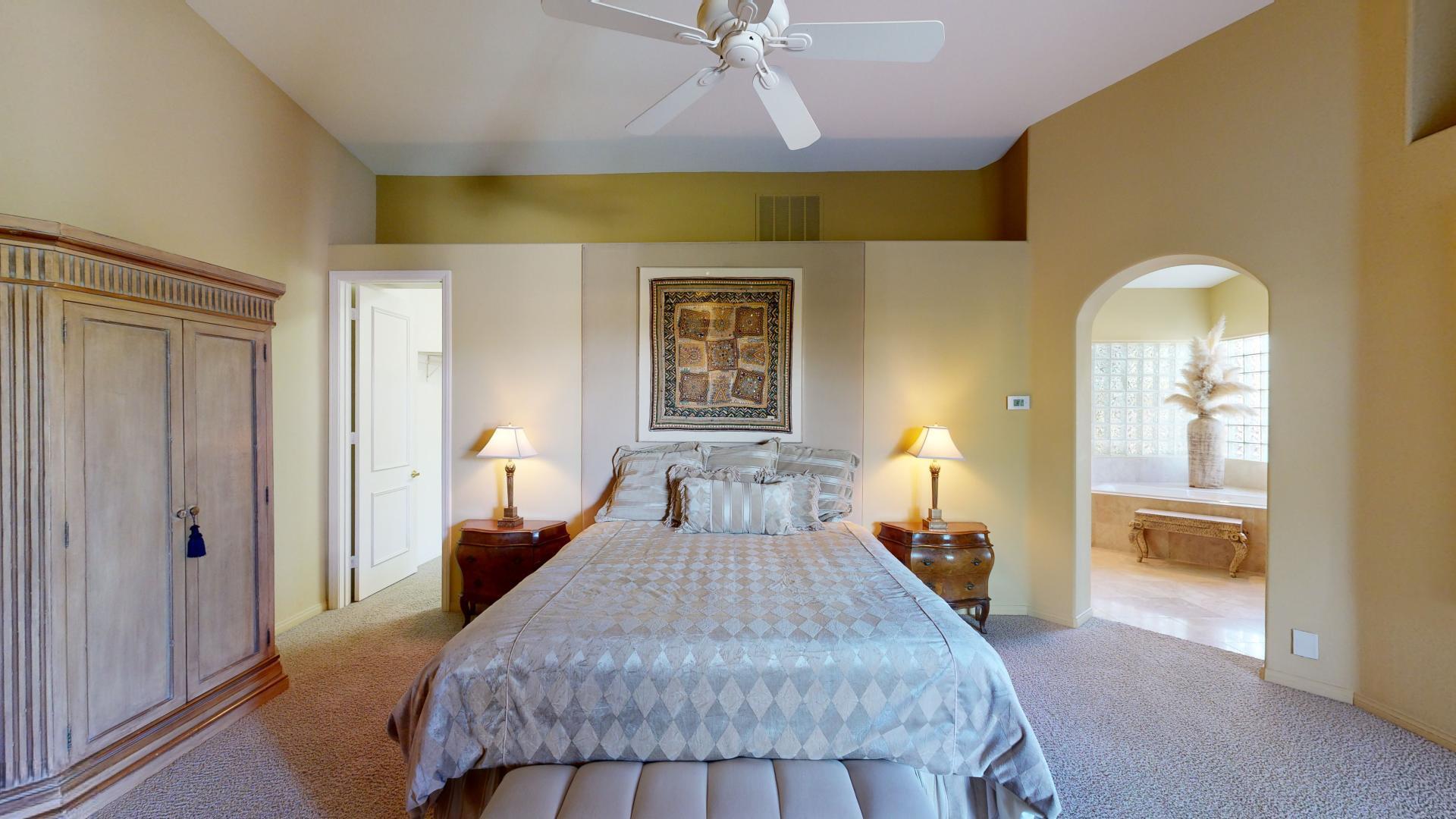 70410 Cobb Road Rancho Mirage, CA 92270 - Photo 54 of 75 a bed room with a bed and a chandelier
