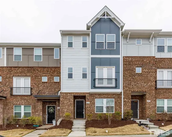 a front view of a brick building with many windows