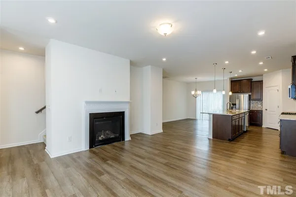 a view of kitchen and dining room with wooden floor