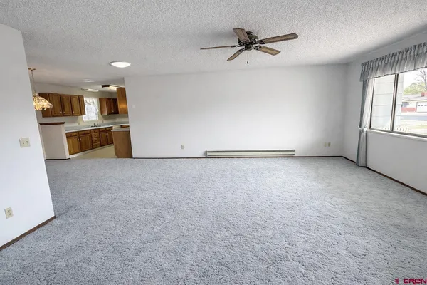 a view of an empty room with a window