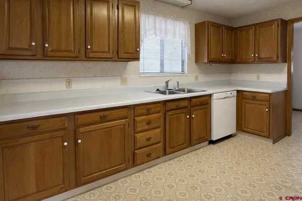 a kitchen with stainless steel appliances granite countertop cabinets and a sink