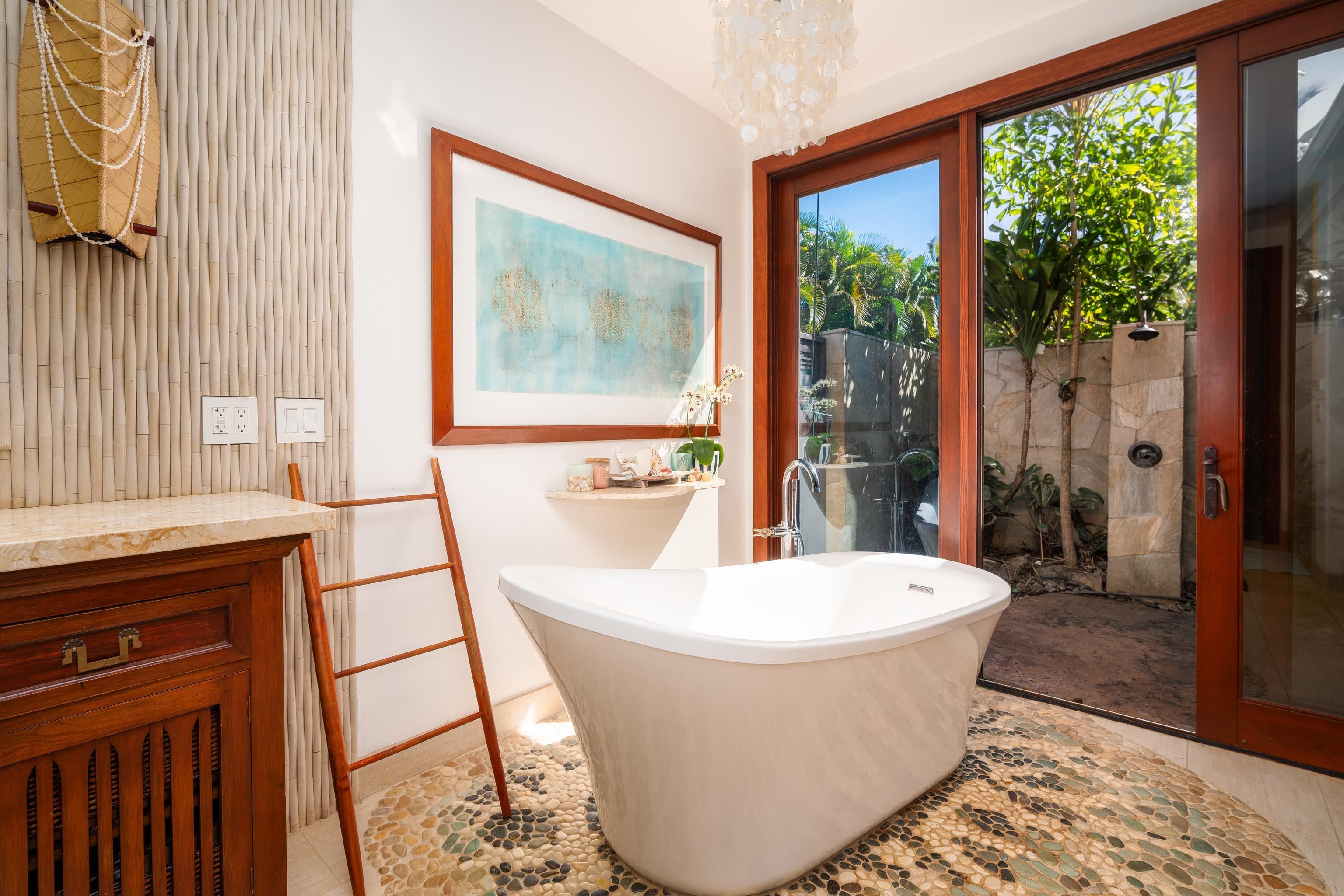 166 Apuwai Street Haiku, HI 96708 - Photo 12 of 30 a view of a bathroom with a bathtub and sink