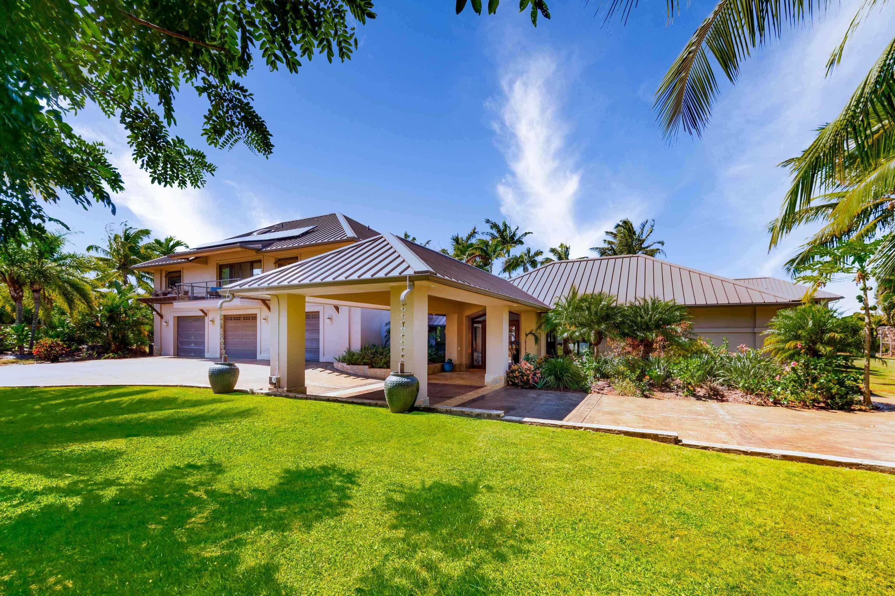 166 Apuwai Street Haiku, HI 96708 - Photo 2 of 30 a front view of a house with a yard table and chairs