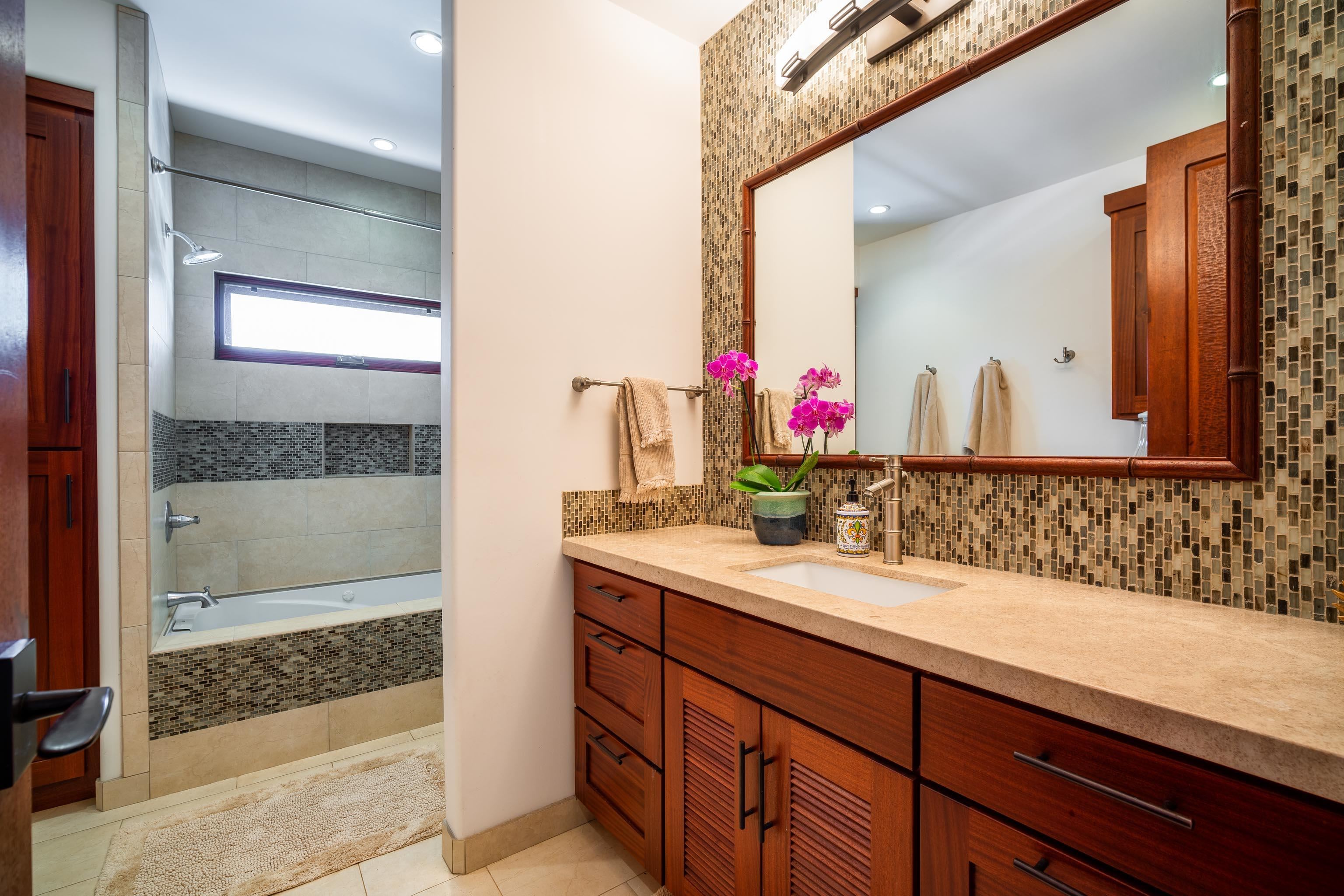 166 Apuwai Street Haiku, HI 96708 - Photo 23 of 30 a bathroom with a sink and a mirror