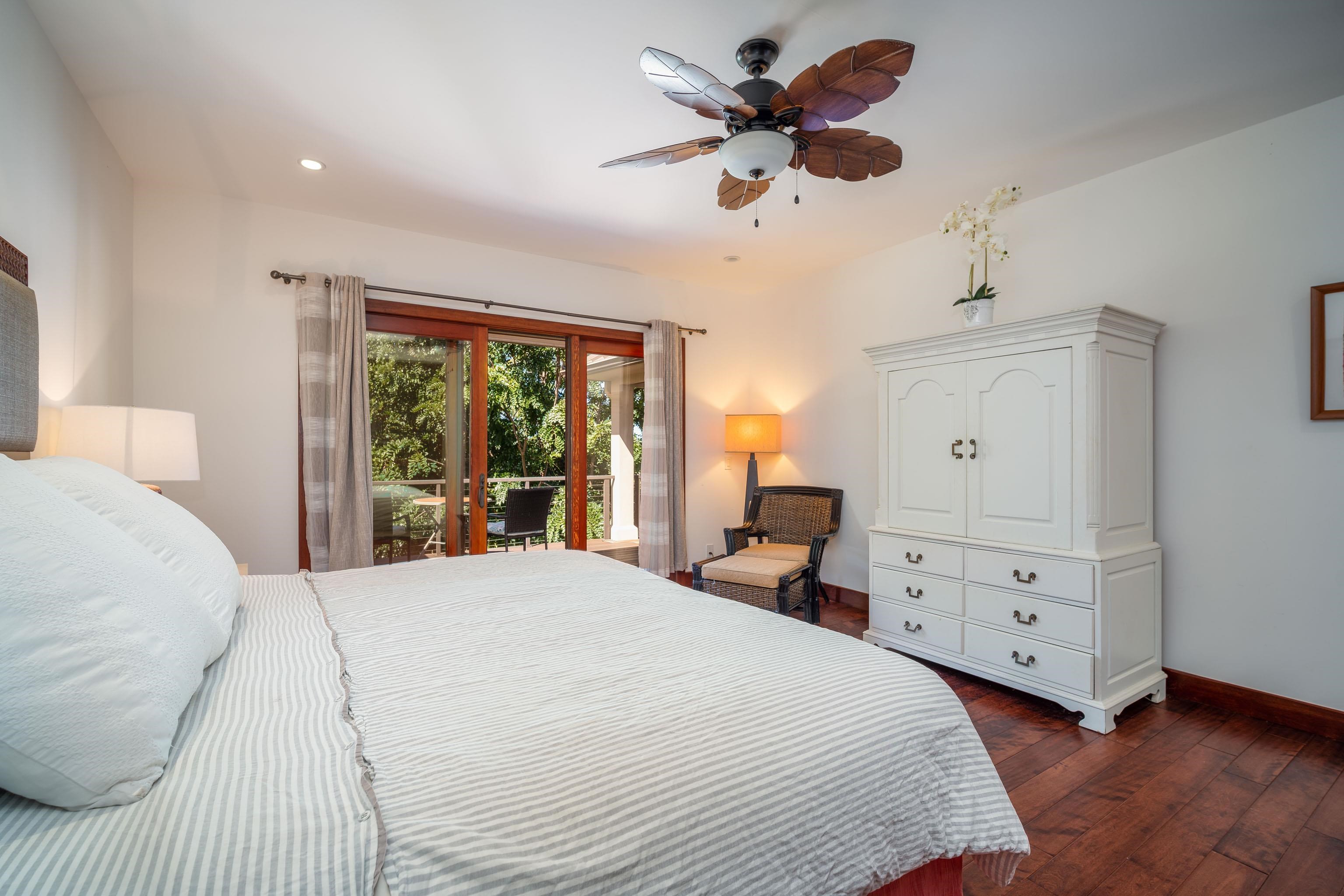 166 Apuwai Street Haiku, HI 96708 - Photo 25 of 30 a bedroom with a large bed and a window