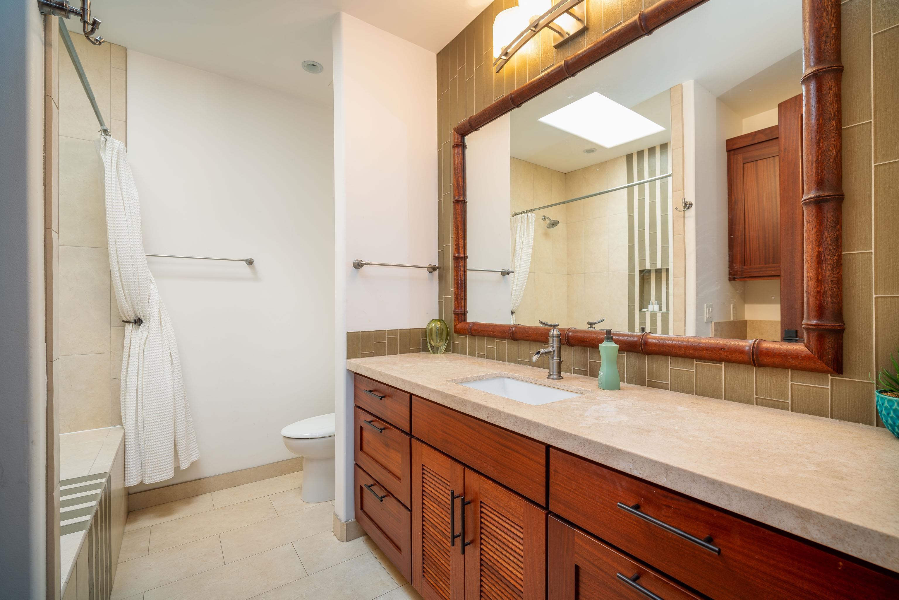 166 Apuwai Street Haiku, HI 96708 - Photo 26 of 30 a bathroom with a sink and a mirror
