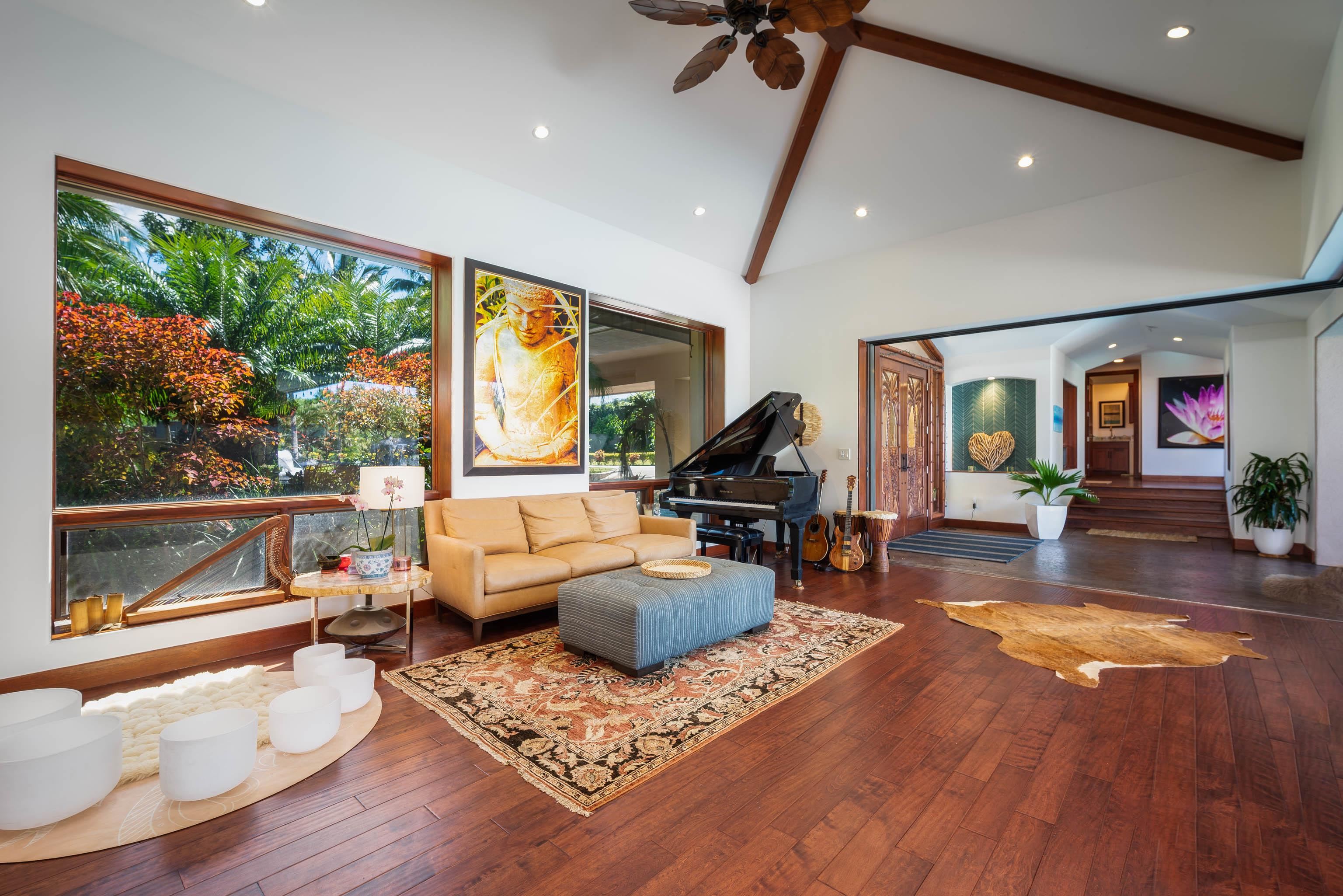 166 Apuwai Street Haiku, HI 96708 - Photo 5 of 30 a living room with furniture and a large window