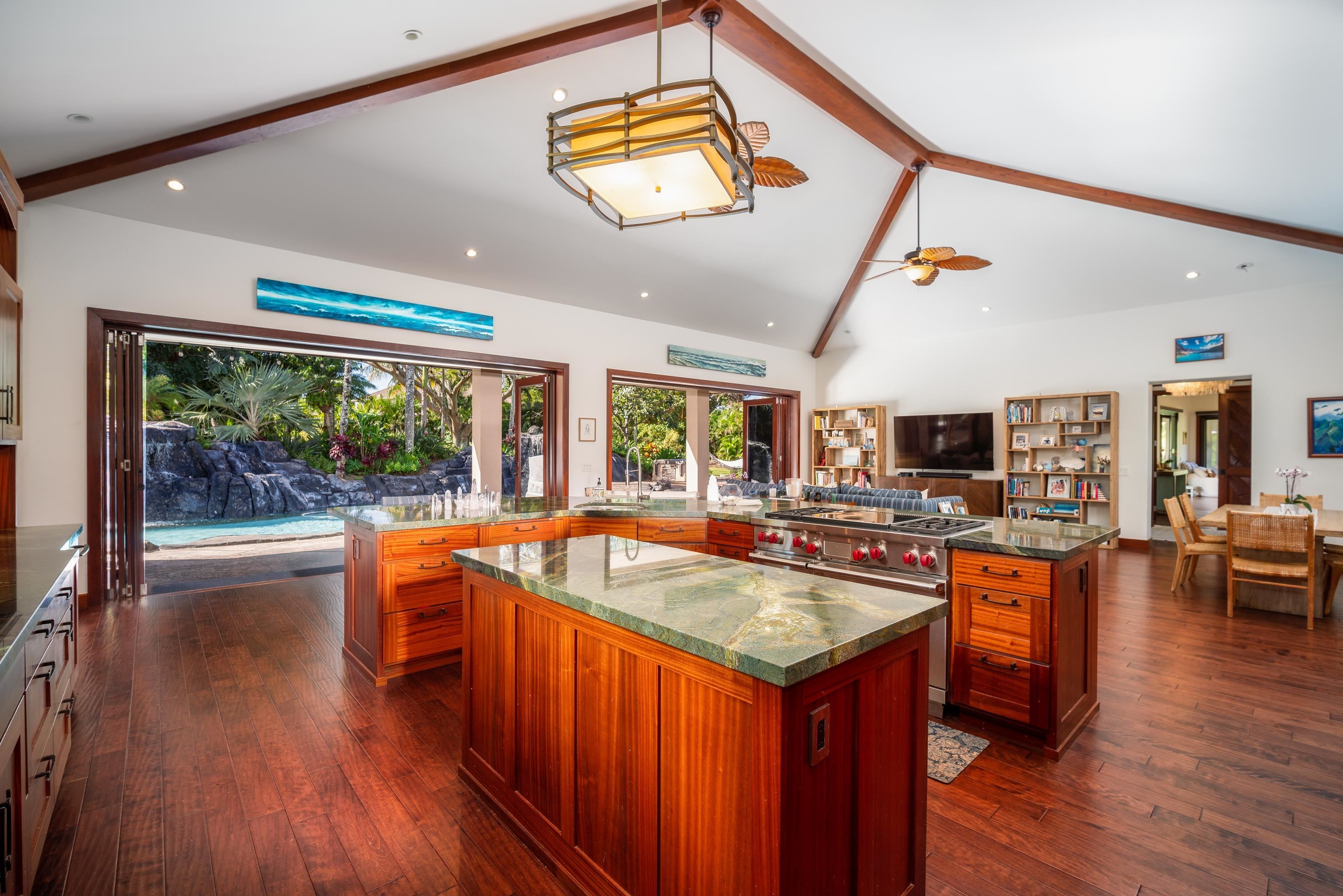 166 Apuwai Street Haiku, HI 96708 - Photo 7 of 30 a kitchen with a stove a sink and a refrigerator