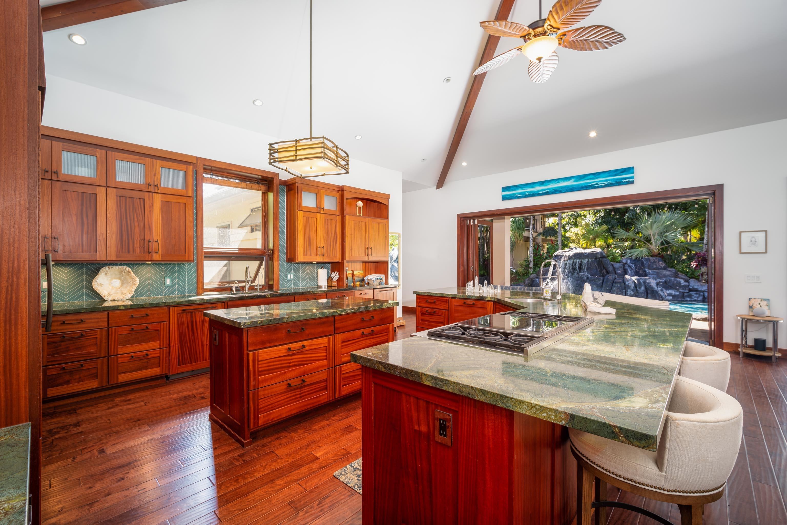 166 Apuwai Street Haiku, HI 96708 - Photo 8 of 30 a kitchen with a stove a sink and a wooden floors