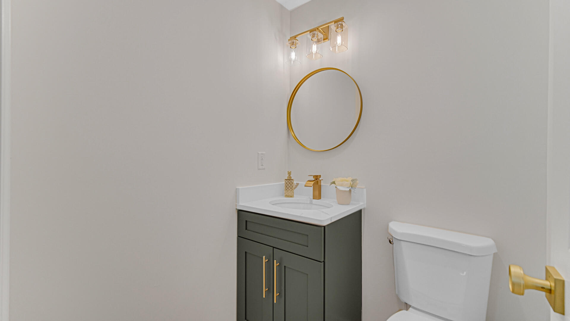 4440 East 13th Place Gary, IN 46403 - Photo 13 of 25 a bathroom with a sink a toilet and a mirror
