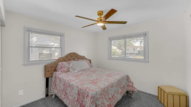 a bedroom with a bed and window