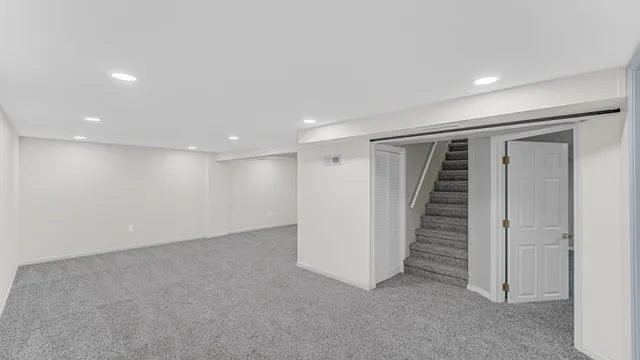 a view of an empty room with stairs