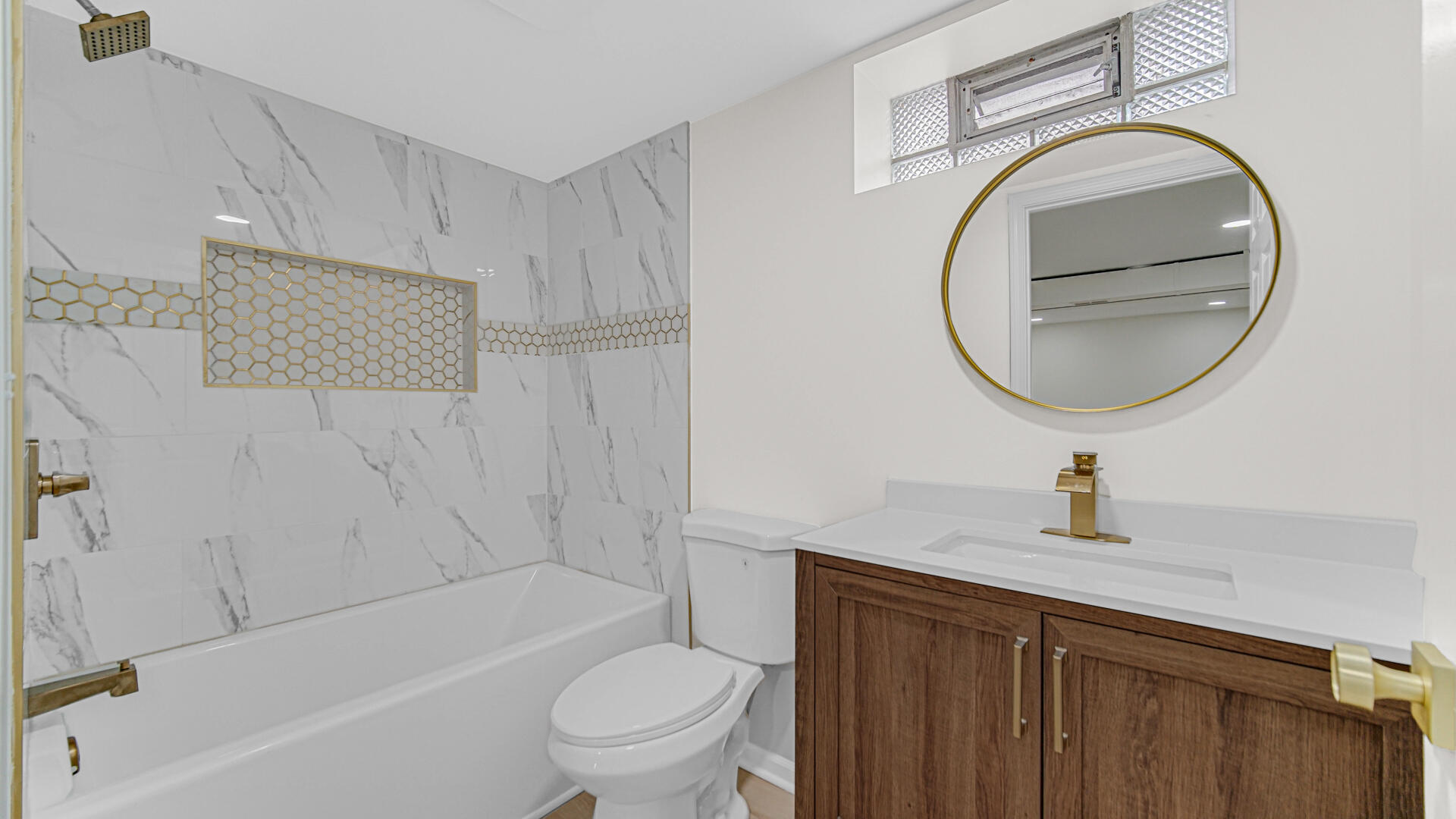 4440 East 13th Place Gary, IN 46403 - Photo 17 of 25 a bathroom with a sink a toilet and shower